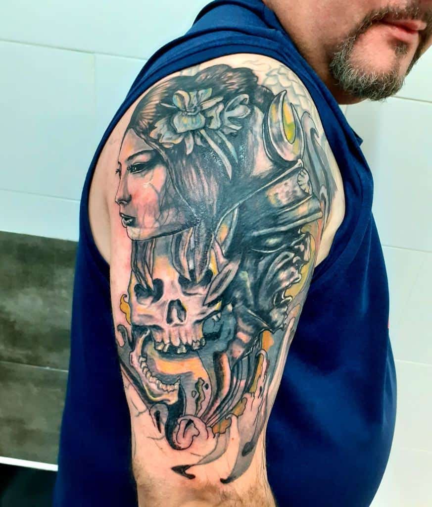 Dark-themed half-sleeve tattoo of a Geisha with a skull, samurai helmet, and flowing details, blending realism with bold shading.