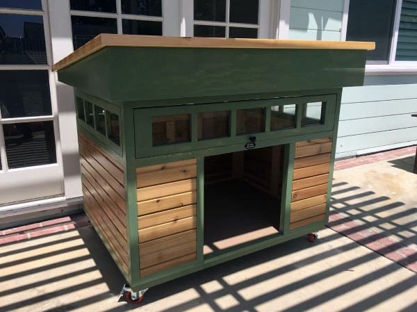 Dog house with green accents and small windows