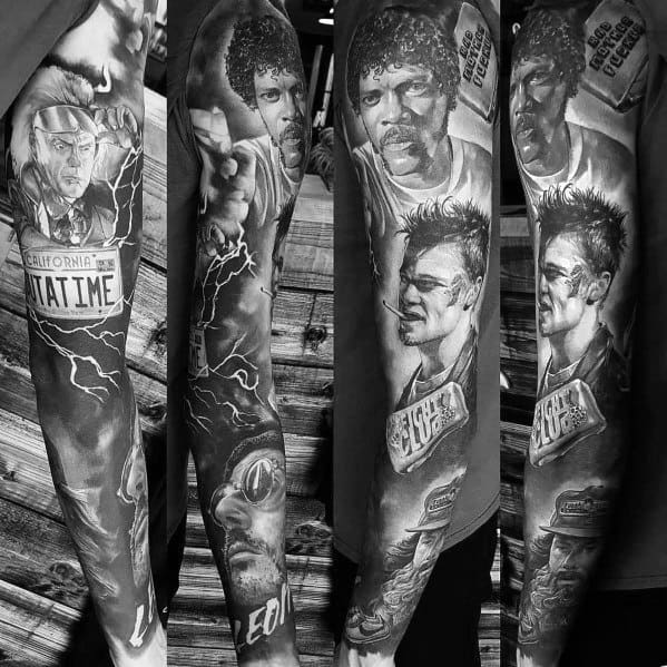 Black and grey full-sleeve tattoo featuring realistic portraits of iconic movie characters, detailed shading, and film-inspired elements.