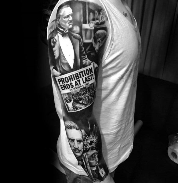 Black and grey full-sleeve tattoo featuring iconic gangster movie characters, a "Prohibition Ends at Last" newspaper, and dramatic shading.