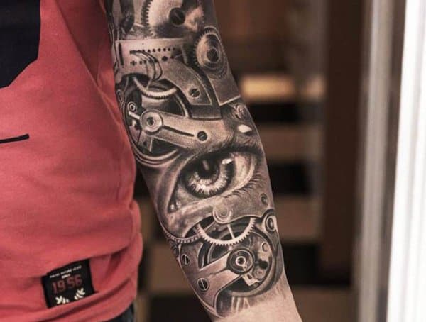 Black and grey biomechanical tattoo sleeve featuring a realistic eye integrated with mechanical gears, creating a futuristic cyborg effect.