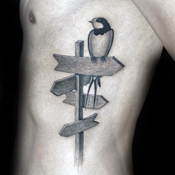 Bird On Sign Unique Mens Ribs Tattoo Ideas