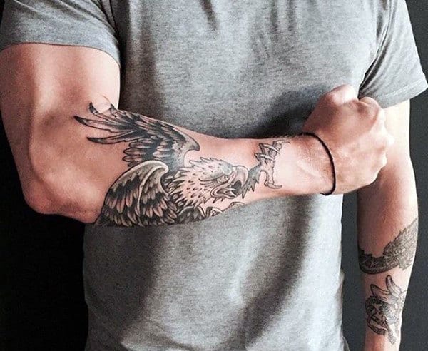 Forearm tattoo of an eagle with outstretched wings