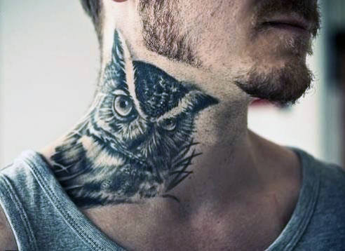 Owl tattoo on man's neck