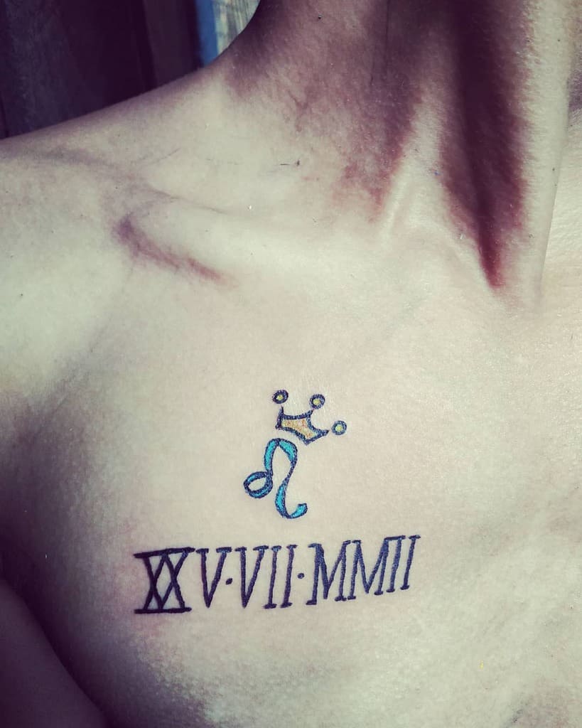 Small Leo zodiac tattoo with a crown above it, paired with Roman numerals, symbolizing royalty and strength.