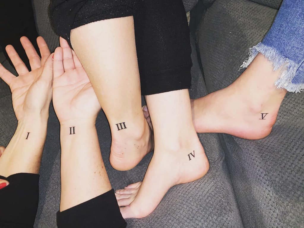 Matching sister sibling tattoos featuring Roman numerals I to V, representing birth order and strong family bonds