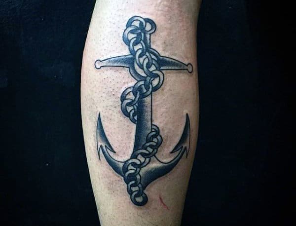 Tattoo of an anchor entwined with rope on an arm