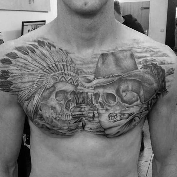 Black And Grey Chest Pieces Tattoo On Man With Cowboy And Indian Skull