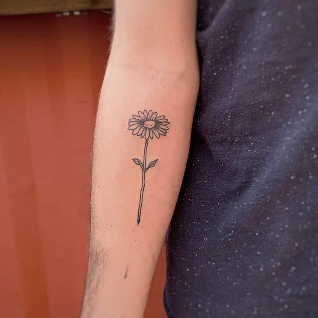 Forearm tattoo black and grey daisy
