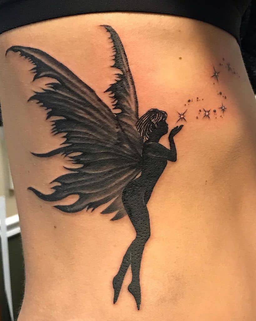 Black And Grey Ink Cute Fairy Tattoo