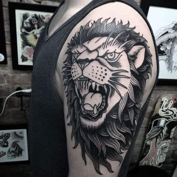 black-and-grey-ink-male-traditional-arm-lion-tattoos