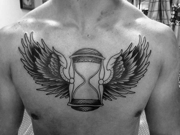 Black And Grey Ink Shaded Winged Traditional Hourglass Guys Chest Tattoo