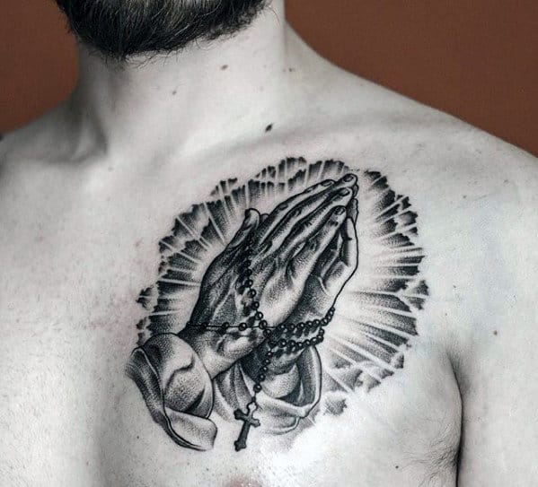 Black And Grey Ink Small Praying Hands With Rosary Chest Tattoos For Men