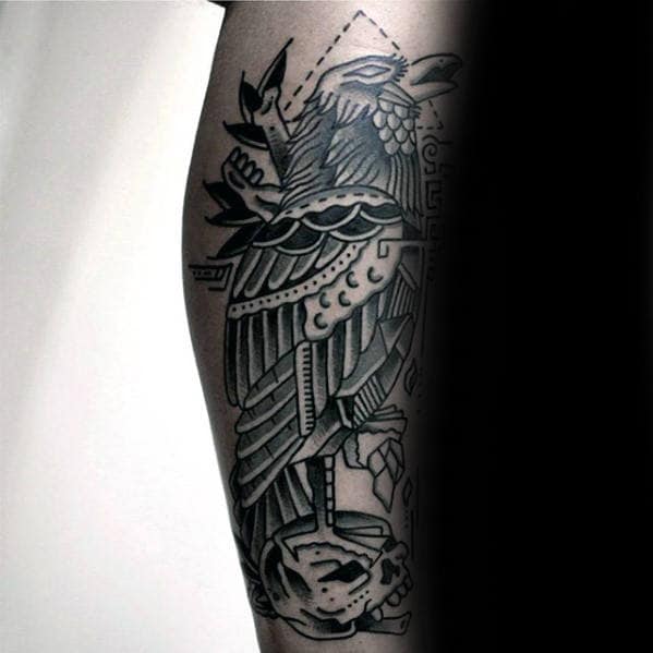 Black And Grey Skull With Crow Traditional Tattoo On Mans Leg