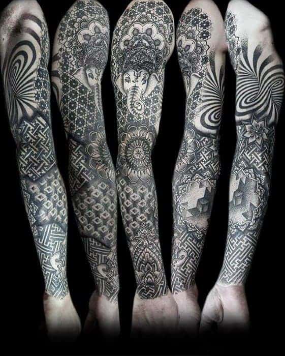 Arms with intricate black ink tattoos featuring geometric and symmetrical patterns