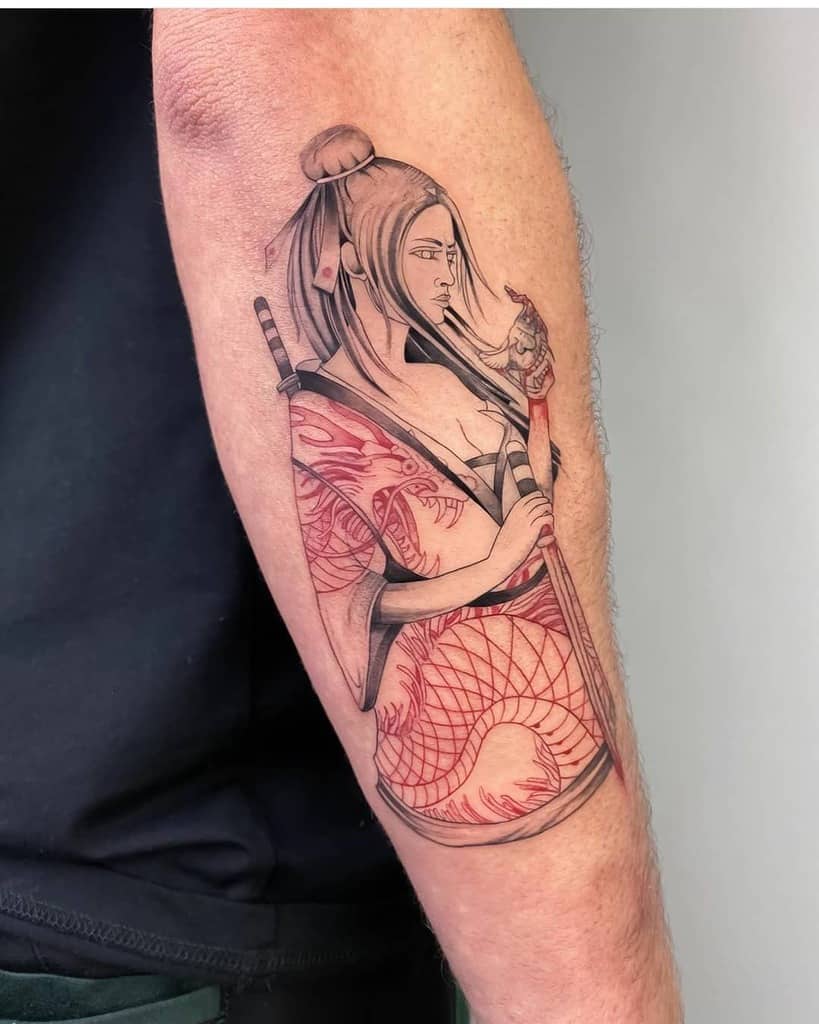 Black and red tattoo of a fierce female warrior in a kimono, holding a katana and a mask, featuring intricate patterns and shading.