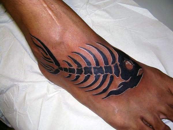 Black And White Ink Fish Skeleton Mens Foot Tattoo