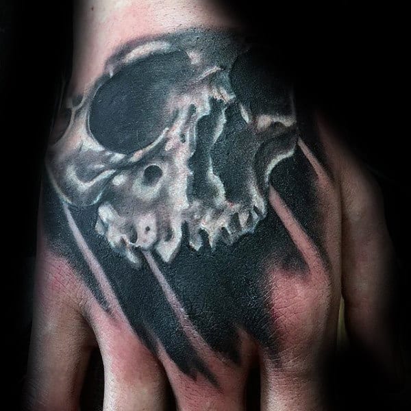 Black And White Ink Skull Hand Tattoo On Gentleman