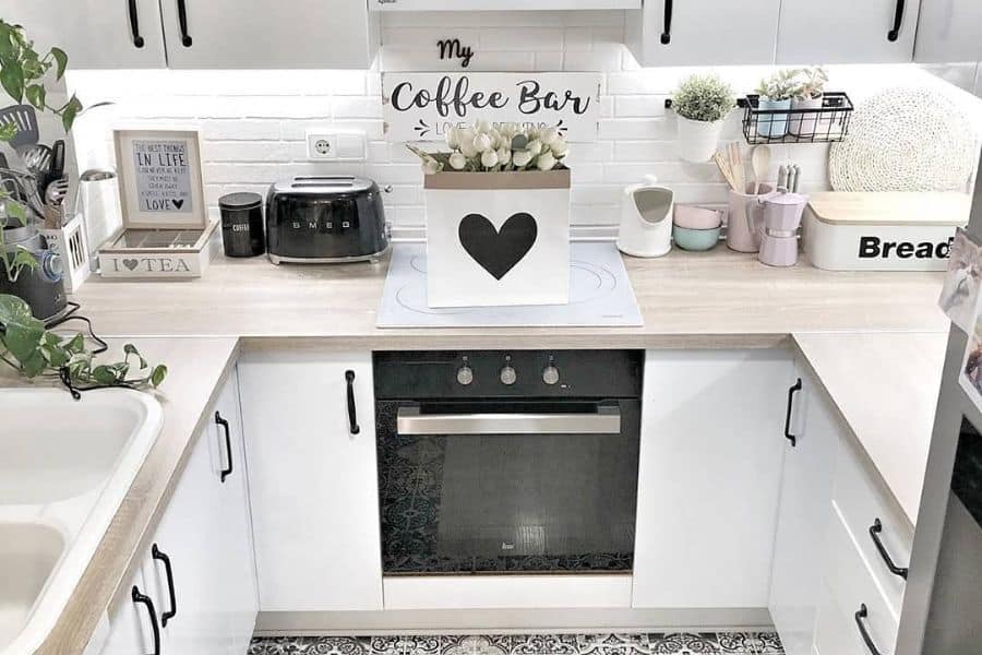 small white kitchen with black accents