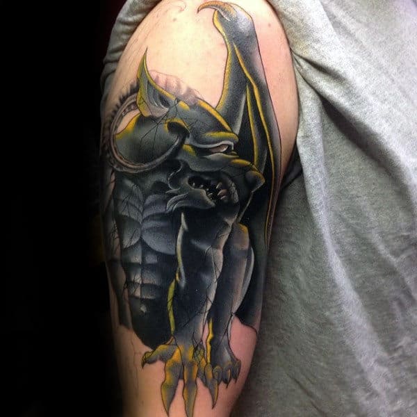 Black And Yellow Gargoyle Guys Arm Tattoo
