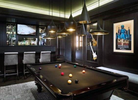 black basement billiards room pendant lights wet bar