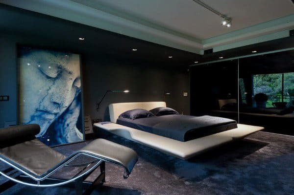 Contemporary black bedroom with floating bed, artistic decor, and floor-to-ceiling windows.