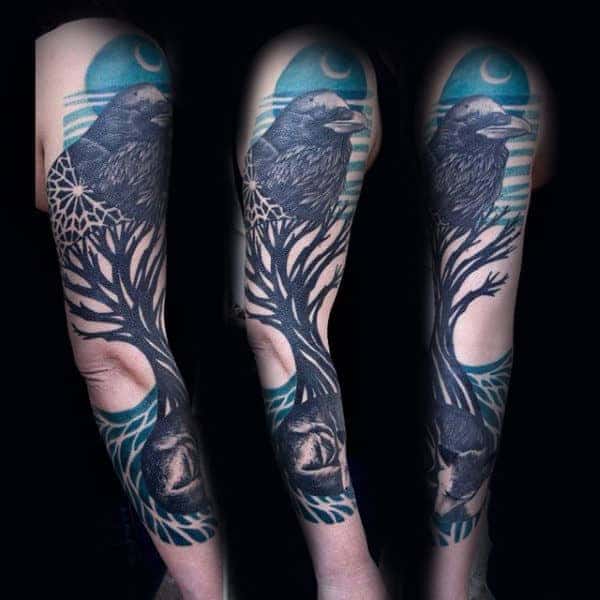Tattoo of a raven on an arm with a tree and moon background, shown from three views