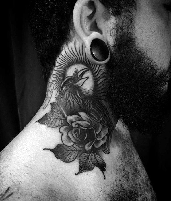 Bold black and grey neck tattoo featuring a crow perched on a rose, with detailed shading and a striking sunburst design