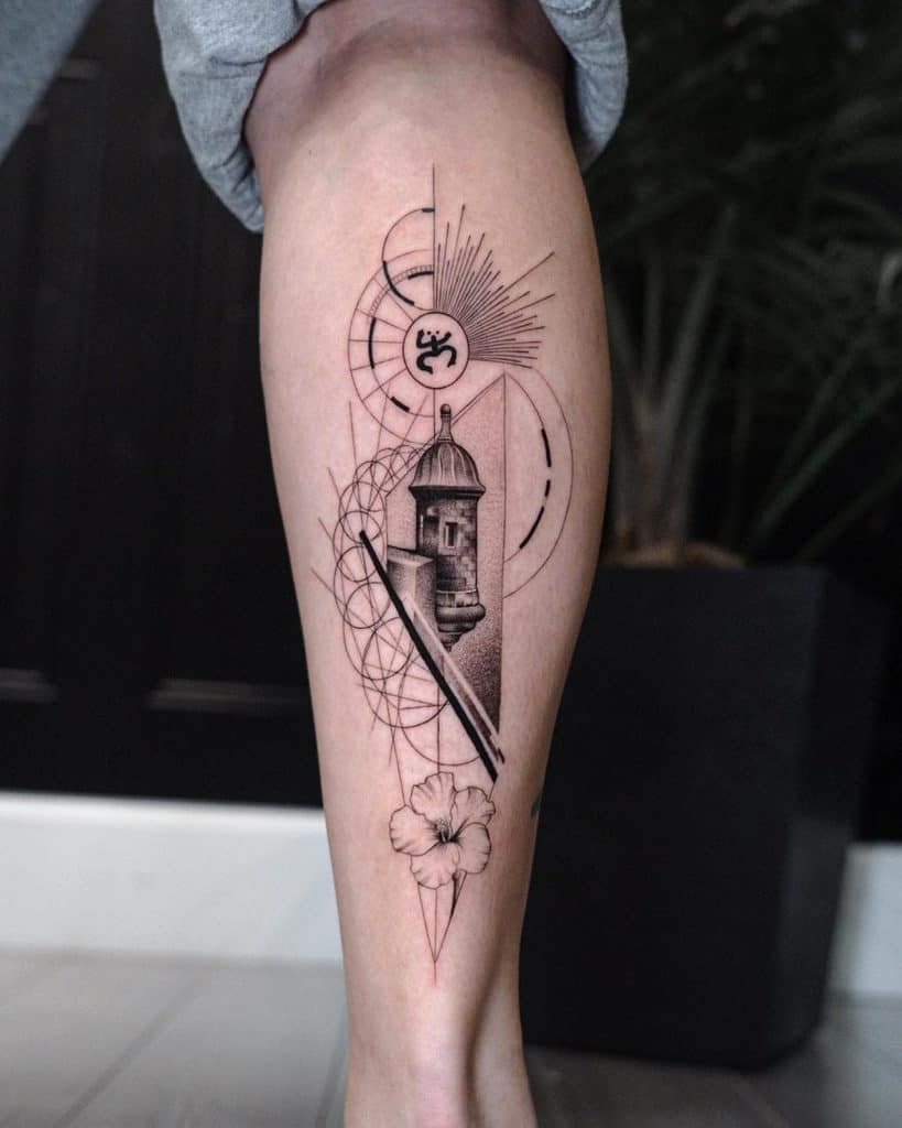 Leg tattoo featuring a historic tower, geometric patterns, Om symbol, and floral details, blending realism with modern geometric art.