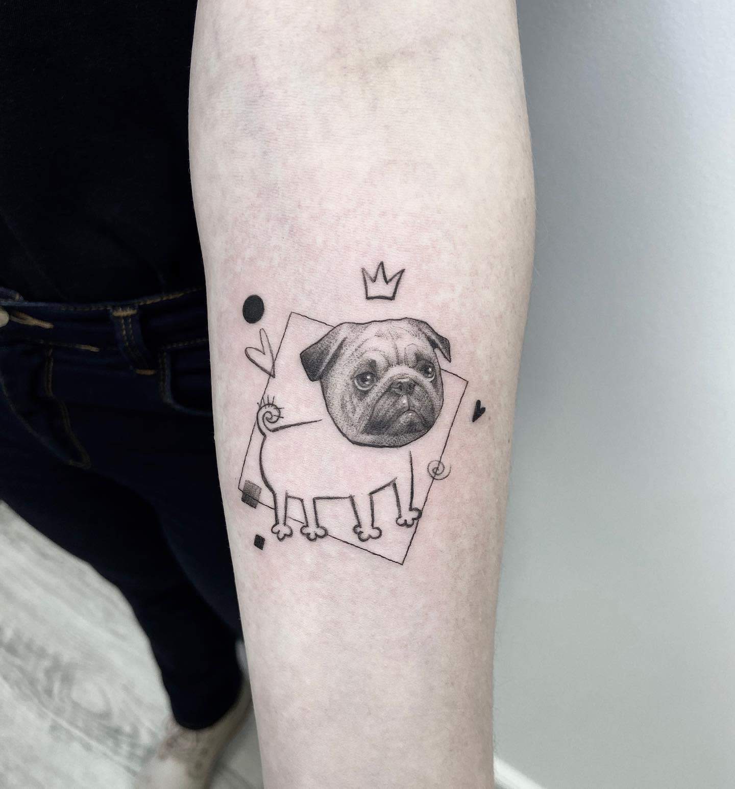 A minimalist black-and-white tattoo of a pug with a crown, surrounded by geometric shapes and playful elements like hearts and dots