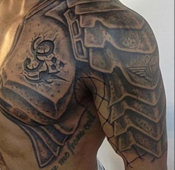 Gladiator-themed armor tattoos on the shoulder and upper arm