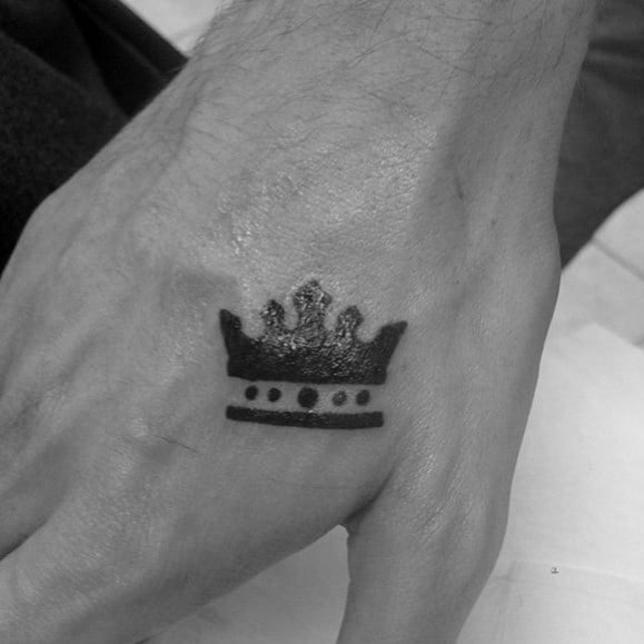 Black Ink Crown Guys Small Tattoo On Hand