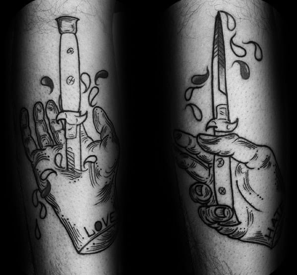 Black Ink Hand With Switchblade Male Tattoo Designs On Forearm