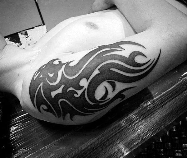 Black Ink Lion Mens Sick Tribal Tattoo On Arm