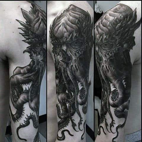 Black Ink Masculine Cthulhu Tattoo On Mans Arm