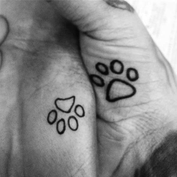 Black Ink Outline Dog Paw Print Mens Small Hand Tattoos