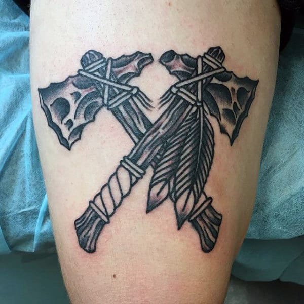 Black Ink Outlined Tomahawk Guys Tattoo On Thigh