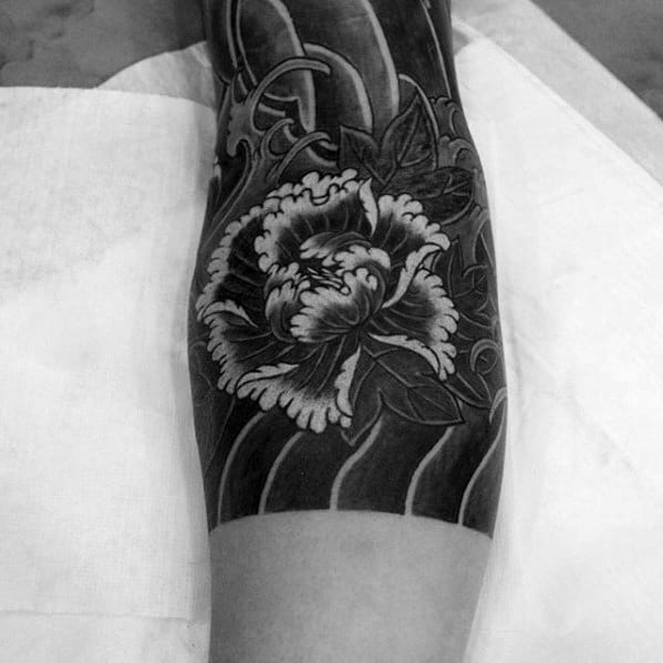 Black Ink Shaded Japanese Flower Tattoo On Male