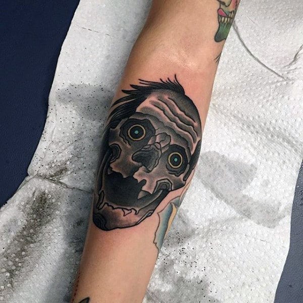 Black Ink Shaded Zombie Face Tattoo On Mans Inner Forearm