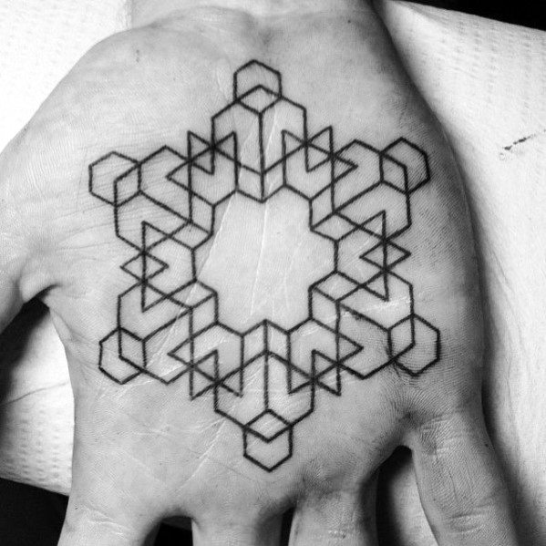 Geometric tattoo featuring interlocking shapes on the palm of a hand