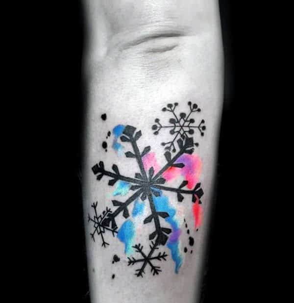 Black Ink Snowflake Tattoo With Colorful Watercolor Background Mens Forearm Tattoo