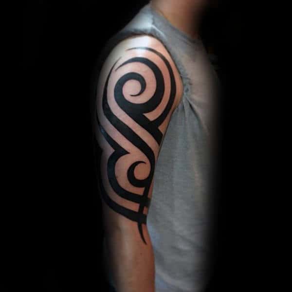 Black Ink Tattoo Of Traditional Classic Tribal Design On Guy