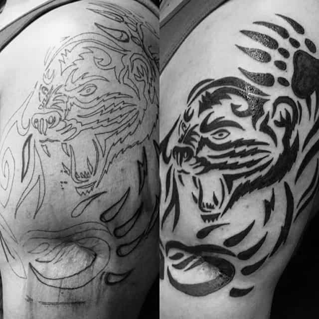 Black Ink Tribal Bear Claw Upper Arm Tattoos On Gentleman