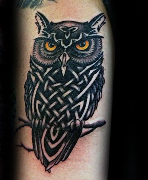 Black Ink Tribal Owl With Glowing Eyes Tattoo For Men On Arm