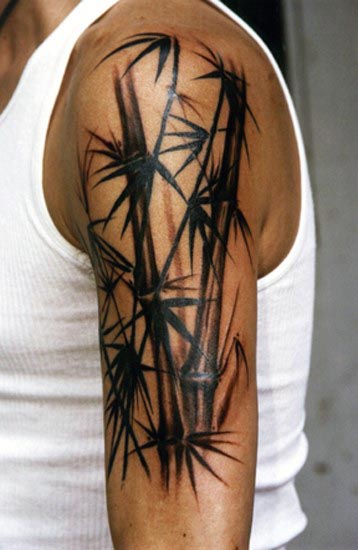 Black Ink Upper Arm Tattoo On Man Of Bamboo
