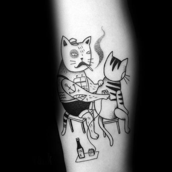 Playful blackwork tattoo of two anthropomorphic cats, one tattooing the other, with a vintage and humorous style.