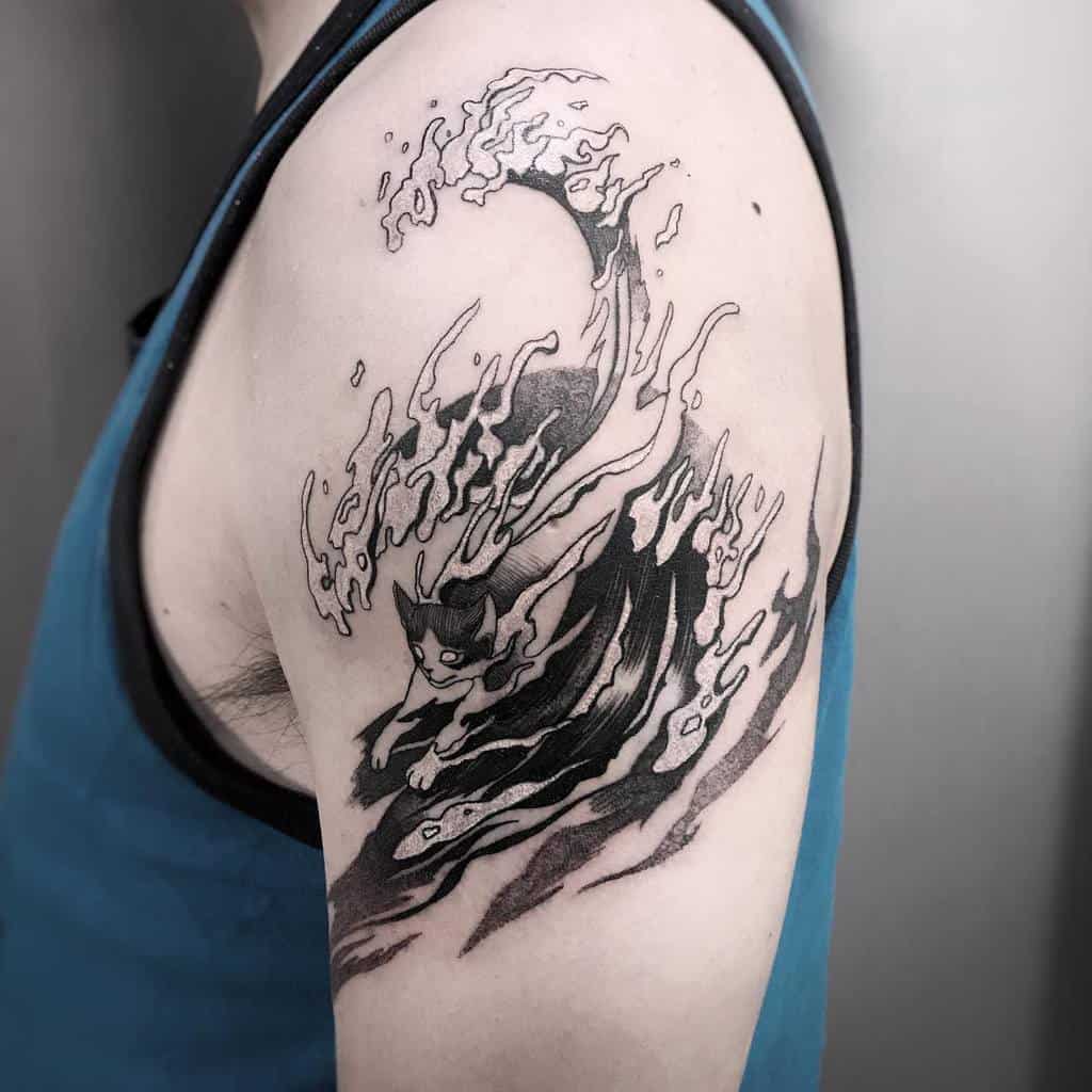 Black and grey tattoo featuring a stylized ocean wave transforming into a cat, blending fluid and dynamic elements