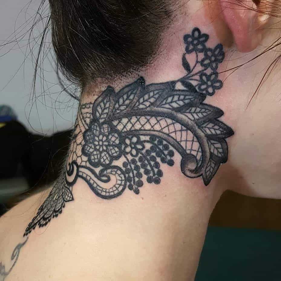 Black lace neck tattoo with floral and ornamental details, featuring delicate netting and elegant swirls for a sophisticated look.