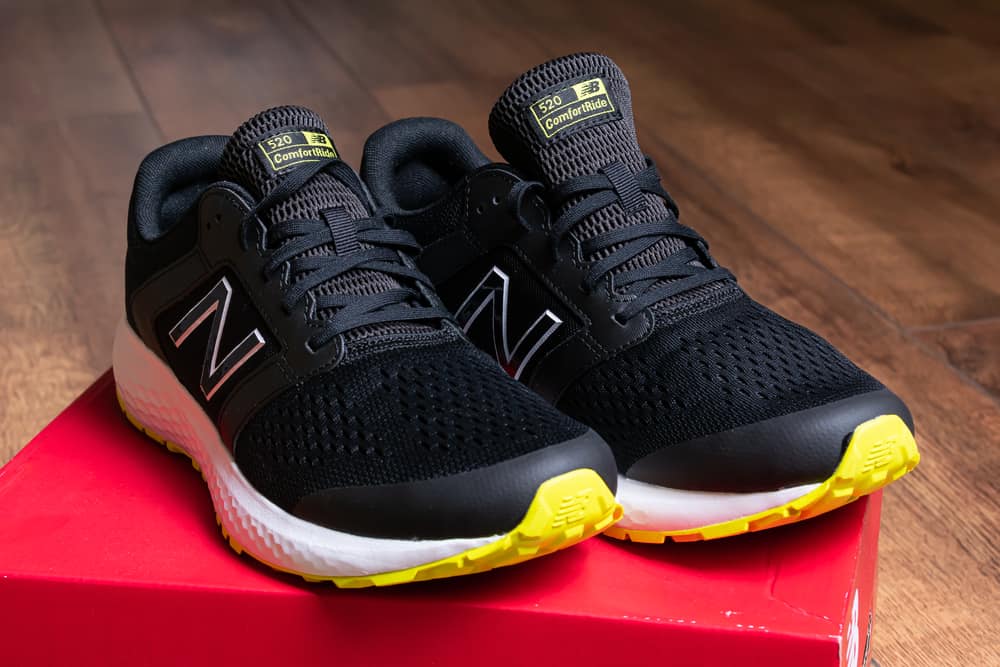 black new balance shoes on red box