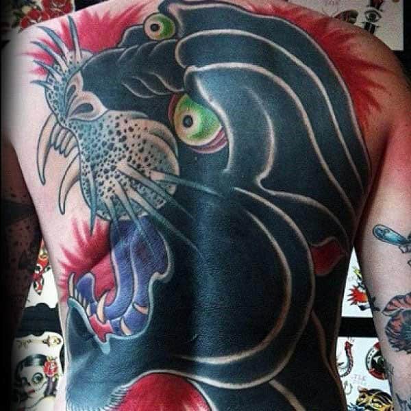 Back tattoo of a fierce panther with open mouth and bushy whiskers